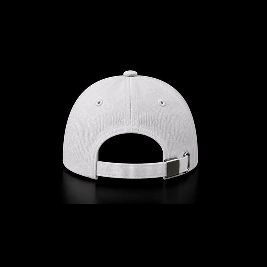White structured baseball cap shown from the back, featuring a subtle tonal circular pattern on the crown and an adjustable strap with a silver metal buckle, set against a solid black background.