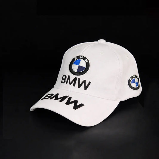 White BMW cap with embroidered logos on a black background