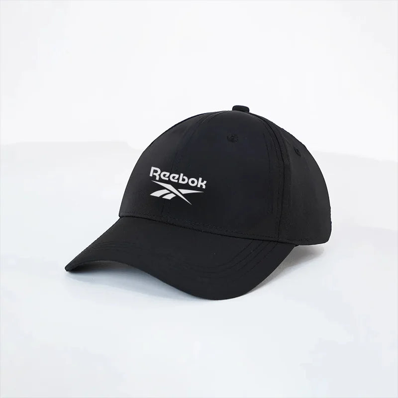 Black Reebok cap on a white background
