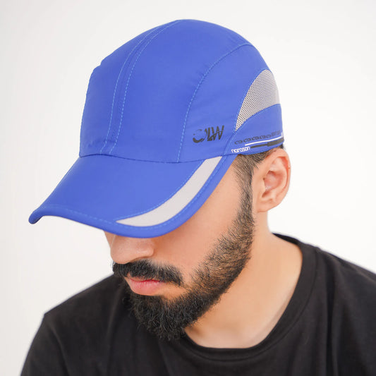 Man wearing a blue cap with a brand logo on a white background