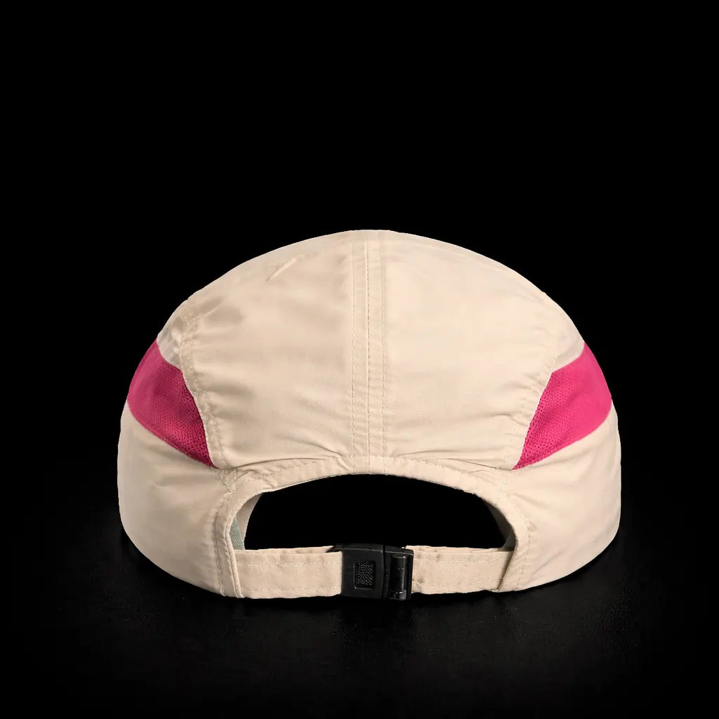 Beige cap with pink accents on a black background