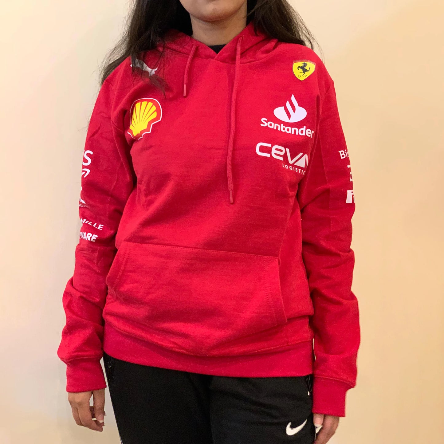 Ferrari red hoodie with yellow Ferrari shield and Shell logo, made by Puma.