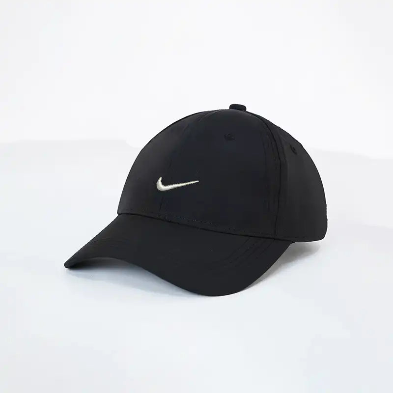 Black cap with a white logo on a light gray background