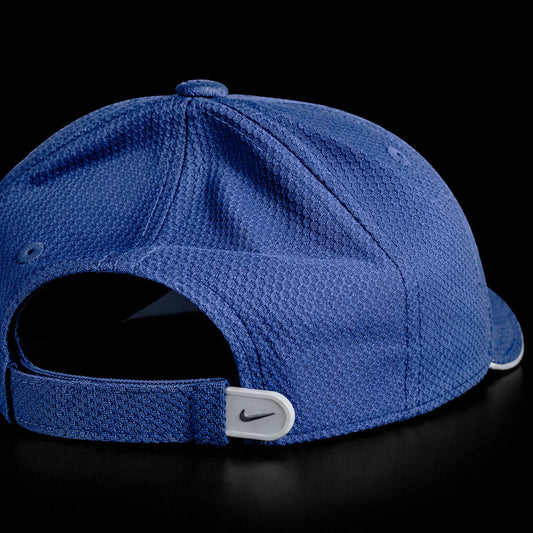 Blue cap with Nike logo on a black background