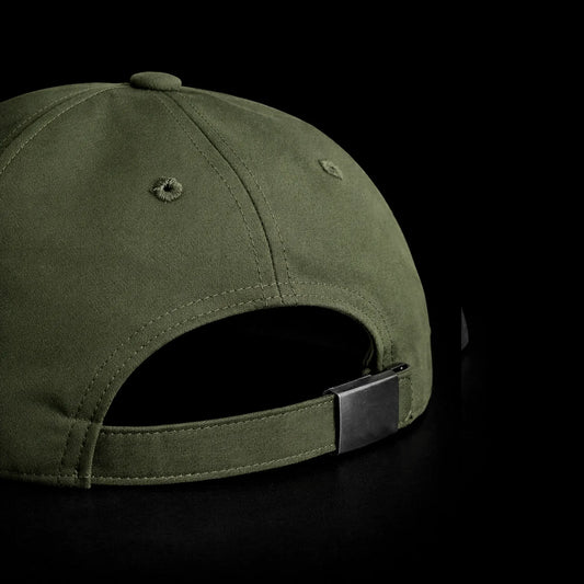 Green cap with a metal clasp on a black background