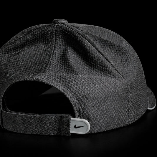 Dark gray cap with Nike logo on a black background