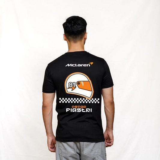 A person wearing a black McLaren Formula 1 t-shirt with a graphic on the back featuring the number 89 and the text 'McLaren' and 'PIASTRI'.
