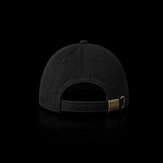 The back view of a black baseball cap with an adjustable strap and a gold-tone metal slider, shown against a solid black background.