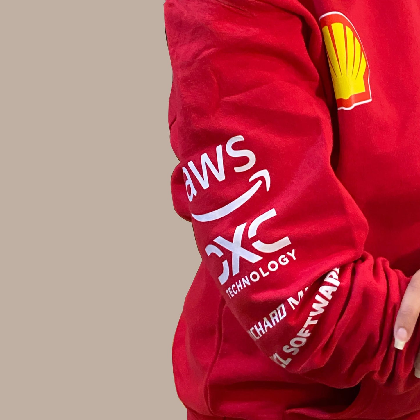 Stylish Ferrari motorsport hoodie in bright red with drawstring hood and kangaroo pocket.