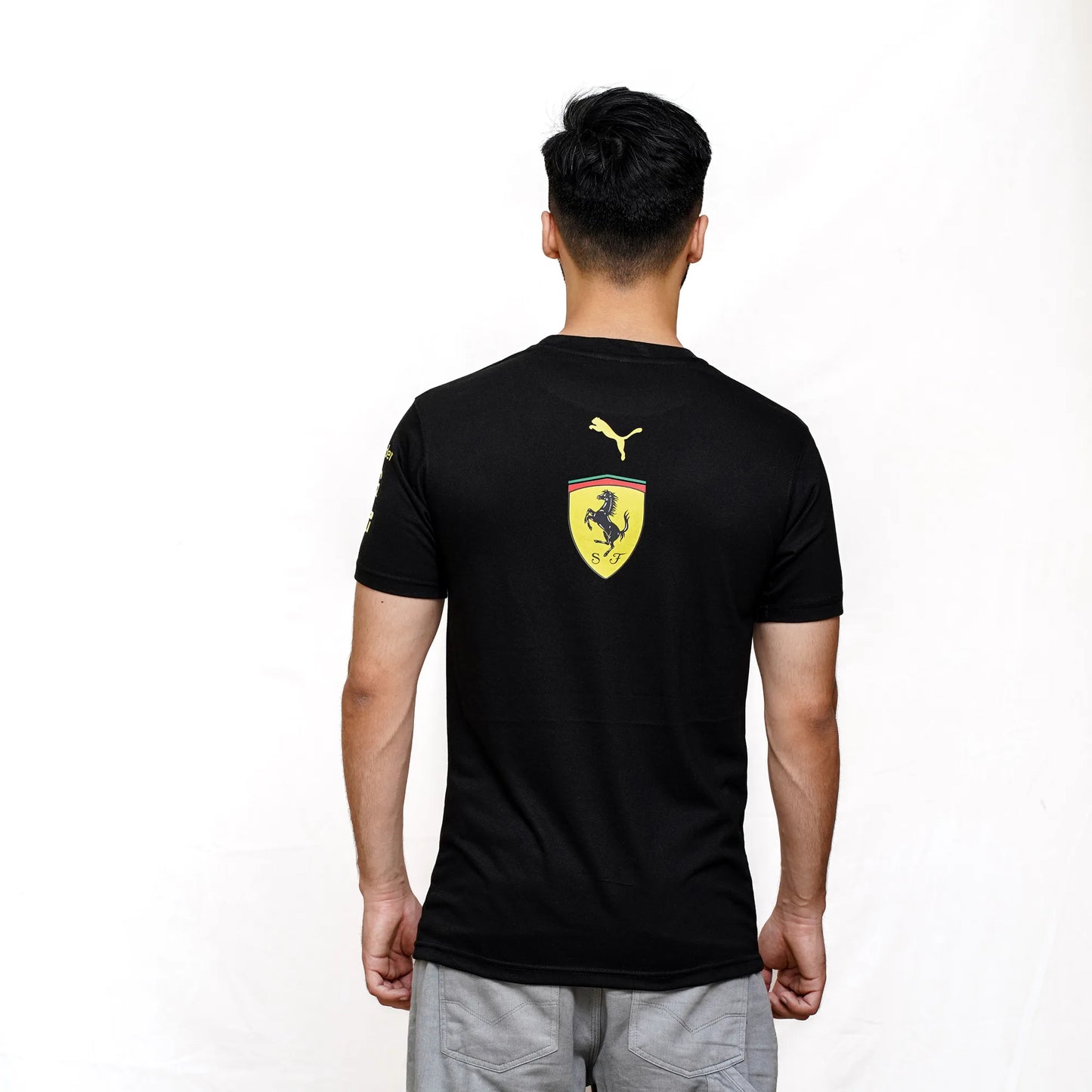 Back view of Ferrari Puma Black Racing T-Shirt showcasing bold sponsor design.