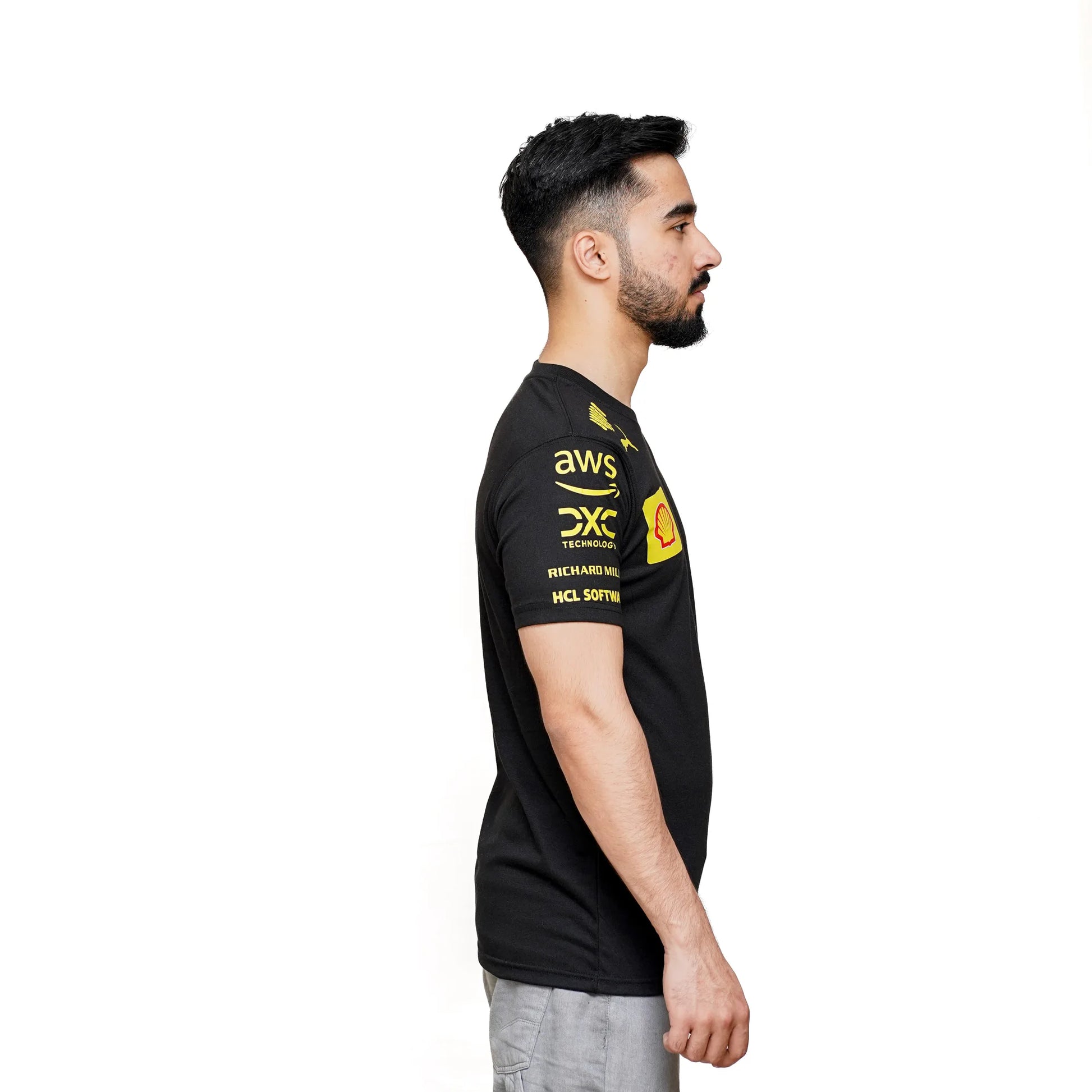 Ferrari F1 Team Black T-Shirt with yellow logo print for motorsport fans.
