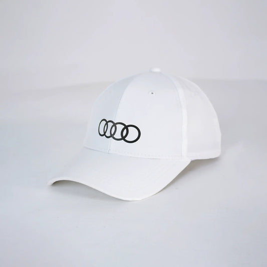 White cap with black Audi logo on a light gray background
