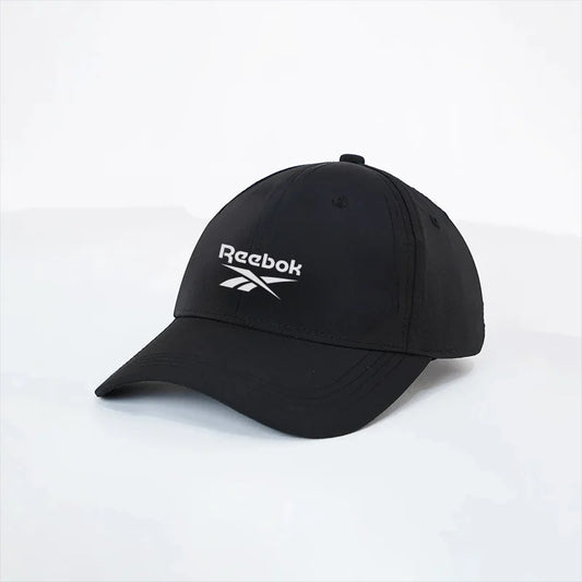 Black Reebok cap on a white background