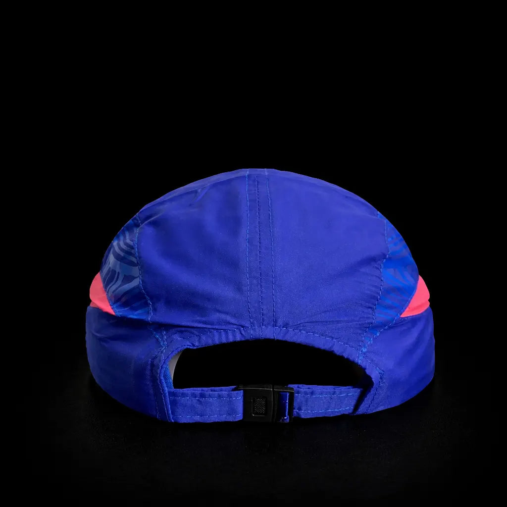 Blue cap with pink interior on a black background