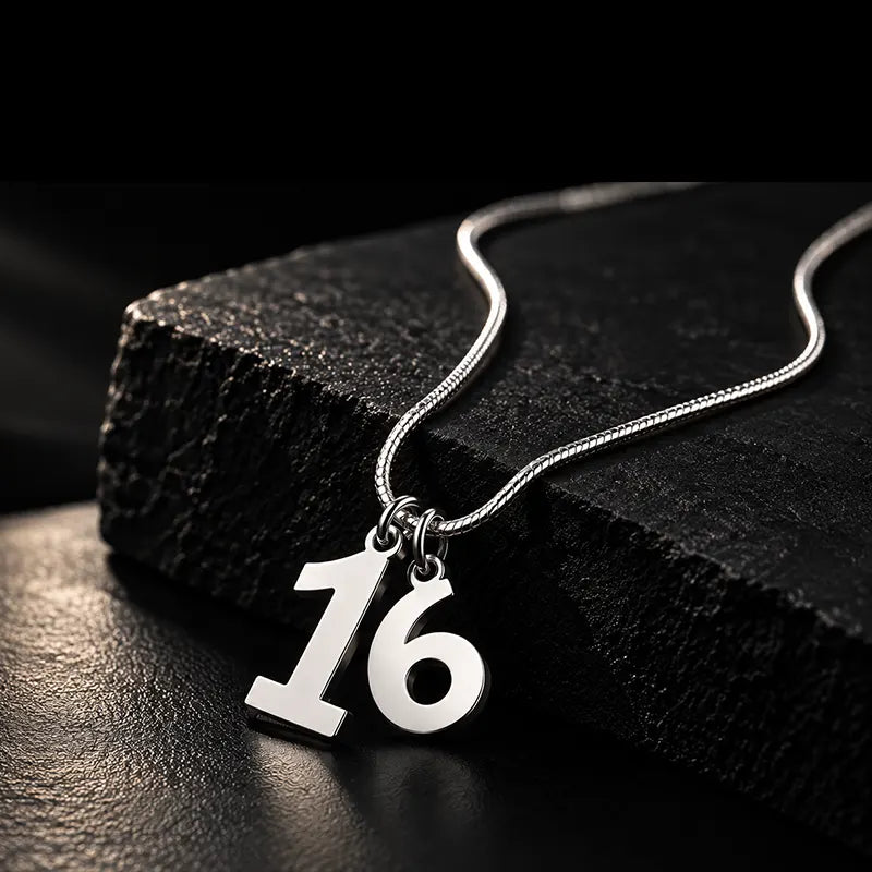 Silver number 16 racing pendant on a chain