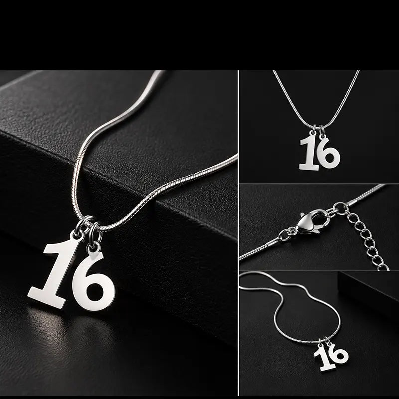 Close-up of silver number 16 racing pendant design
