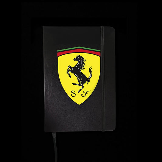Black notebook with Ferrari logo on a black background