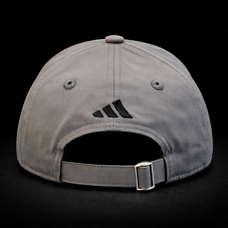 Gray cap with Adidas logo on a black background