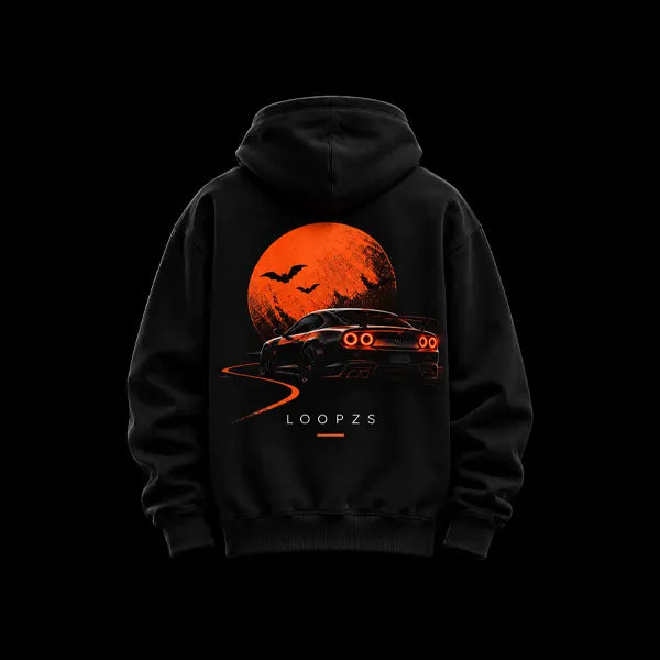 Black oversized Halloween racing hoodie back view with large orange moon, bats and a sports car with red tail lights on a winding road, Loopzs