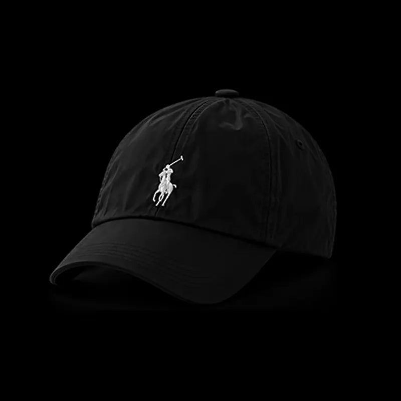 A black cotton baseball cap featuring the white embroidered Polo Ralph Lauren pony logo on the front, set against a solid black background.