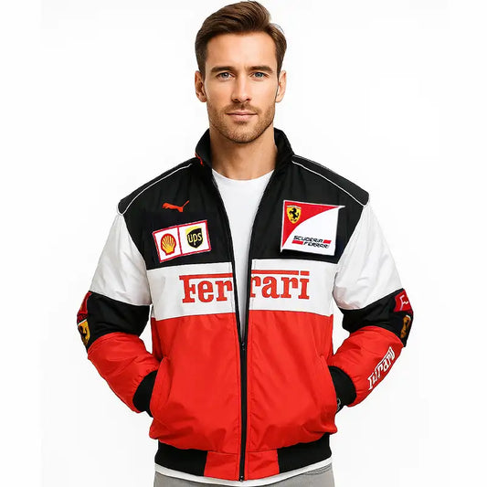 Man wearing a Ferrari jacket with various logos on a white background