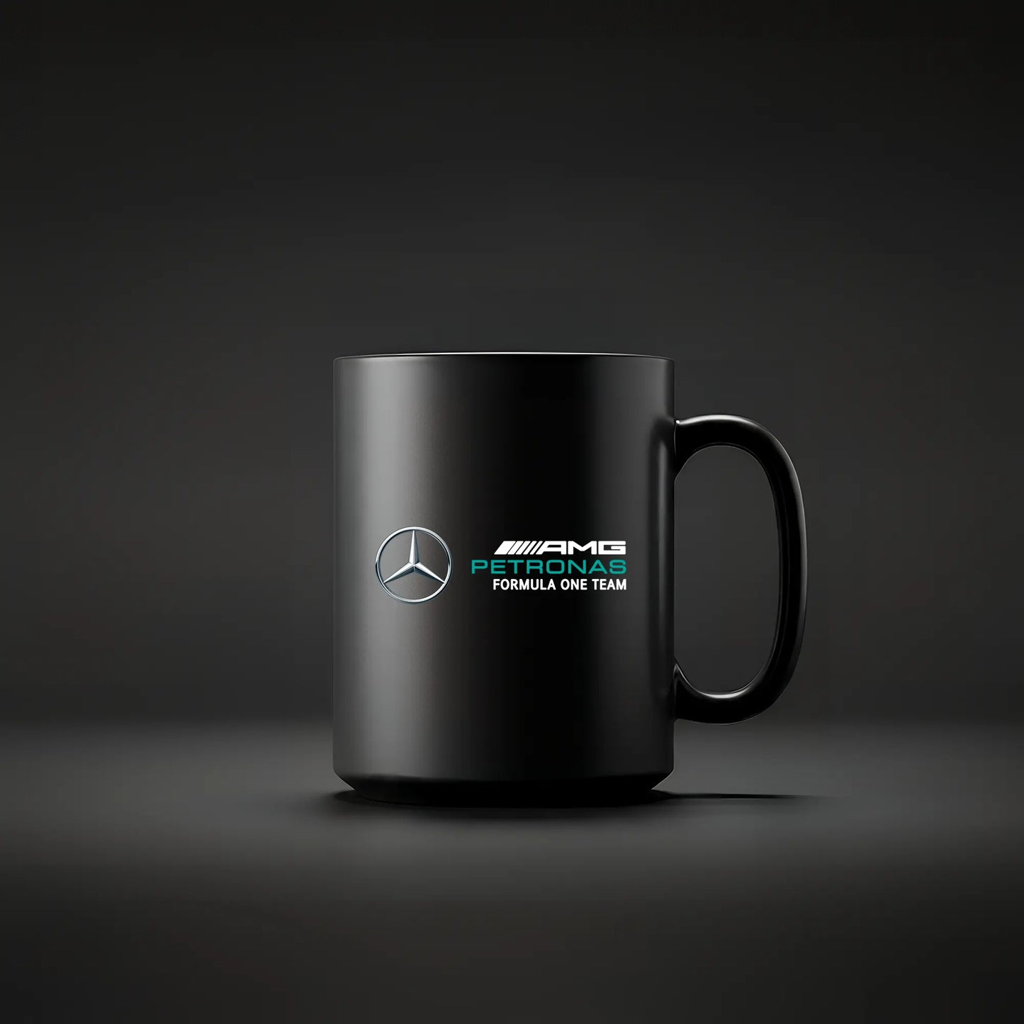 Black mug with Racing Collection AMG F1 logo on a dark background