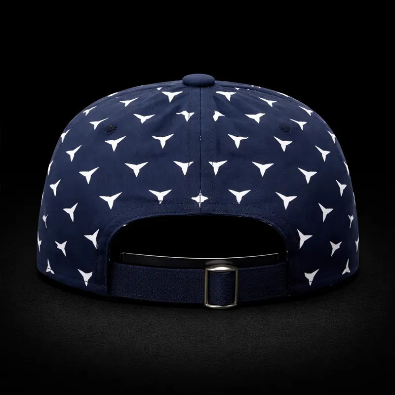 Navy blue cap with white geometric pattern on a black background