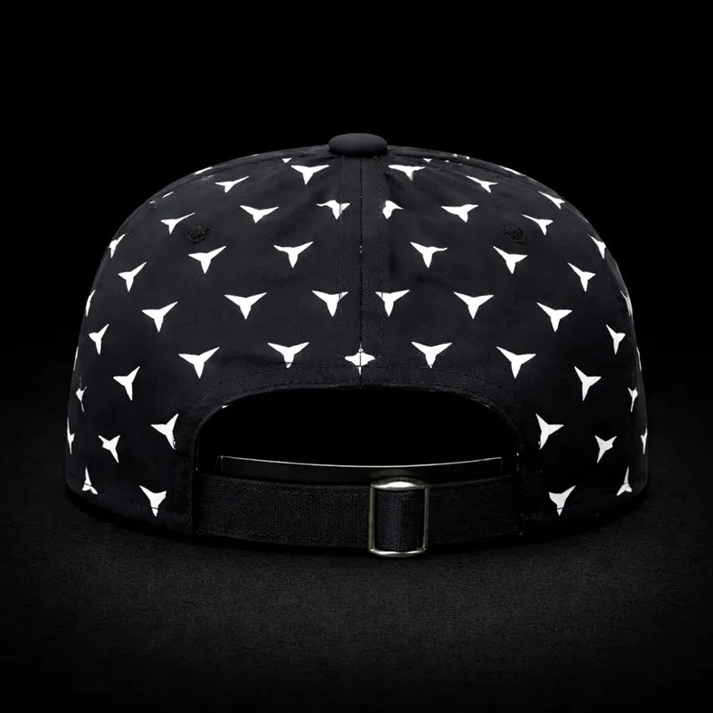 Black cap with white geometric pattern on a black background
