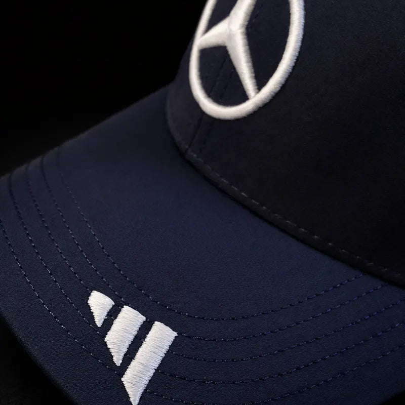 Navy blue cap with Mercedes-Benz logo on a black background