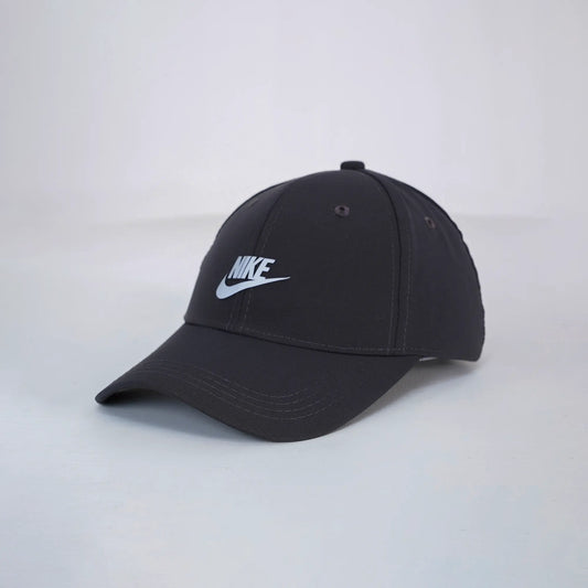 Black Nike cap on a light gray background