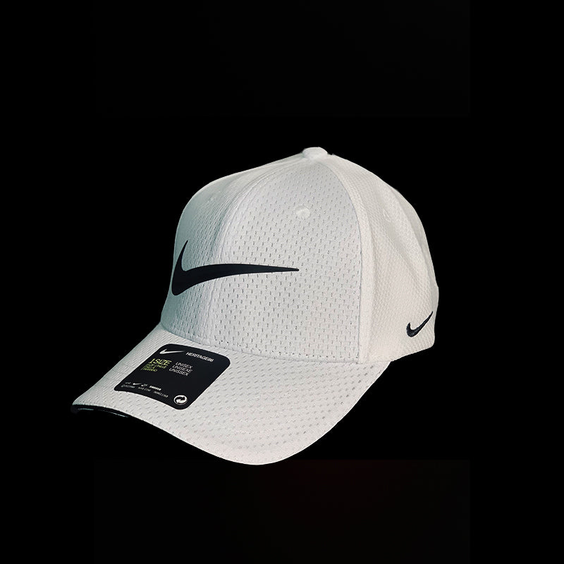 White Nike cap with black logo on a black background