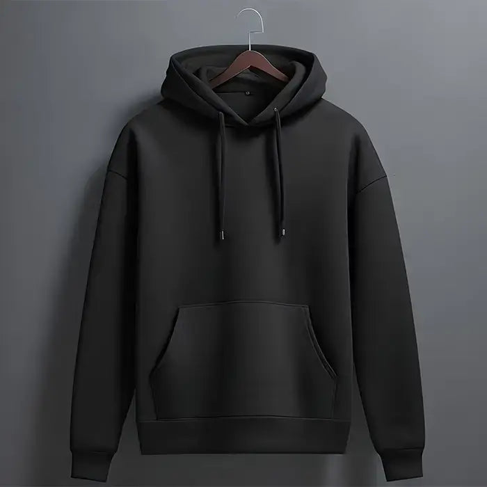 A plain black hoodie with a hood, long sleeves, and a front pouch pocket, displayed on a dark background.