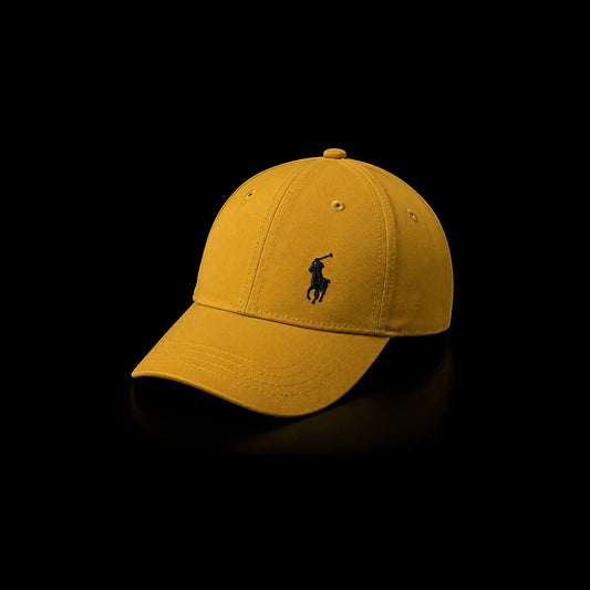 A classic six-panel baseball cap in a warm mustard yellow color, featuring the black embroidered Polo Ralph Lauren pony logo on the front, set against a solid black background.
