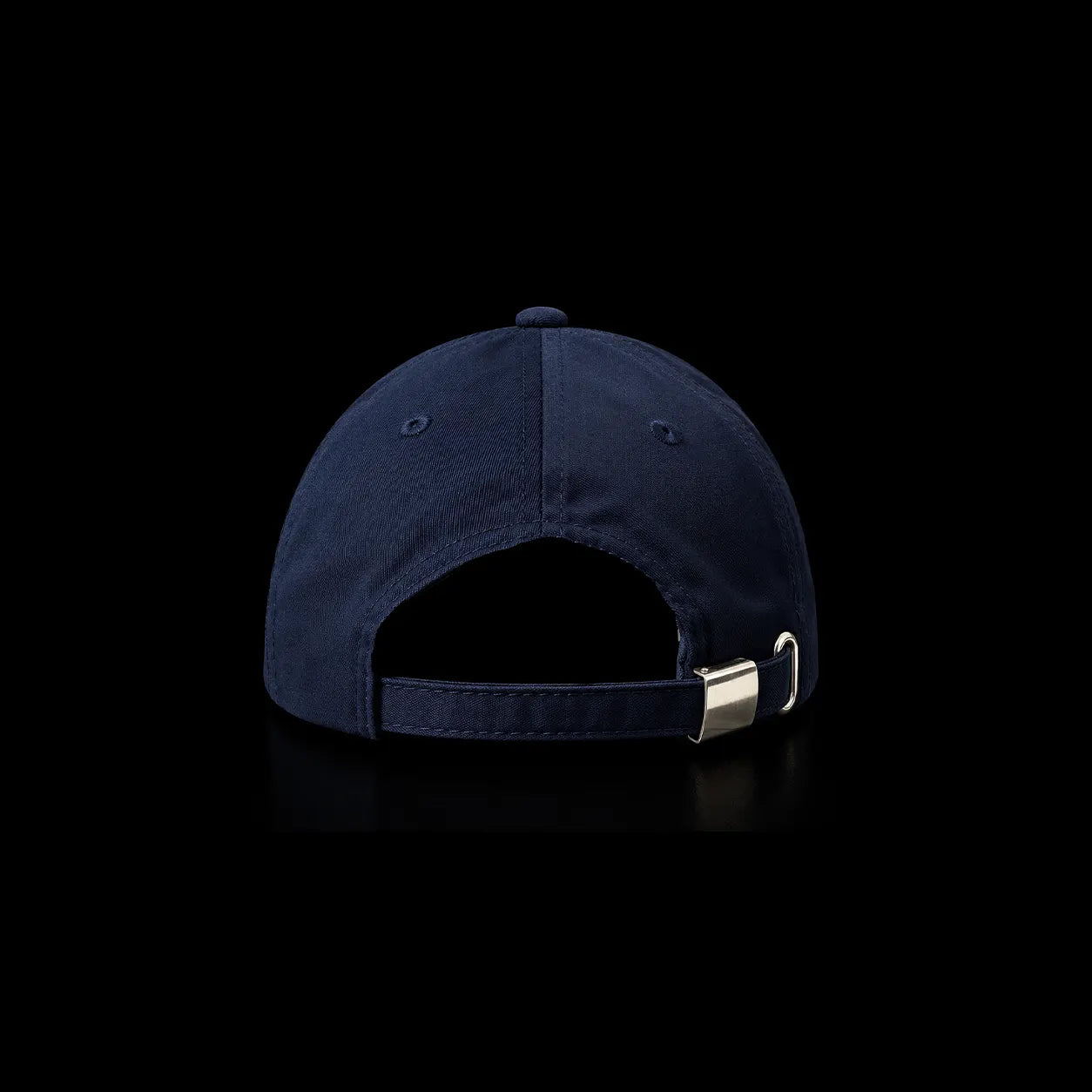 A navy blue baseball cap shown from the back, featuring an adjustable strap with a silver metal buckle, set against a solid black background.