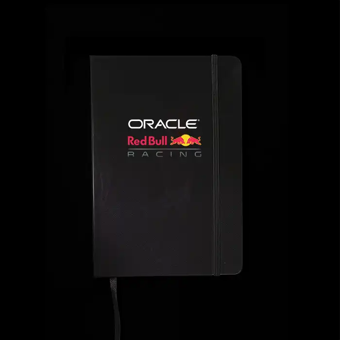 Black notebook with Oracle Red Bull Racing logo on a black background