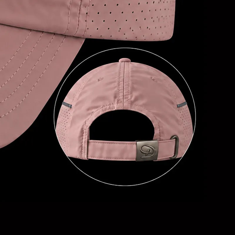 A dusty pink athletic cap shown from the back with a circular inset highlighting the adjustable strap and metal buckle, against a solid black background.