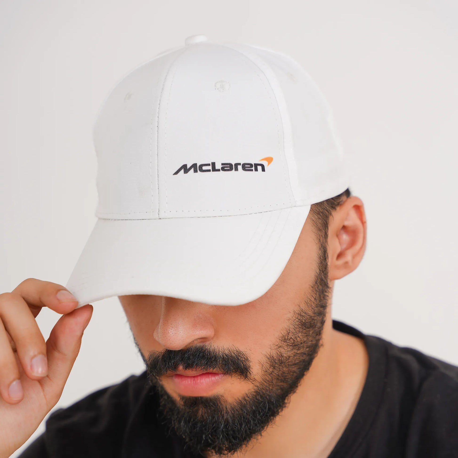 White McLaren F1 cap 2025 edition with black and orange logo – sporty adjustable hat for Formula 1 fans in Pakistan