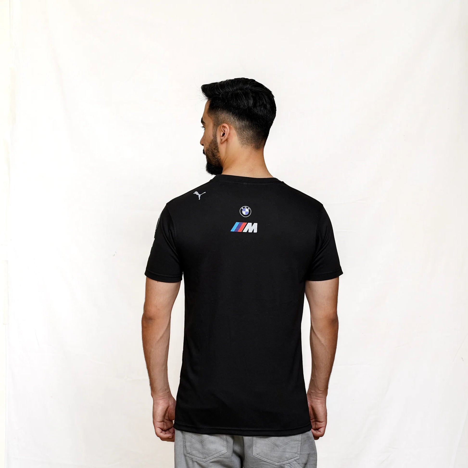 back view of the BMW M Motorsport and PUMA collaborative white T-shirt featuring prominent chest logo.