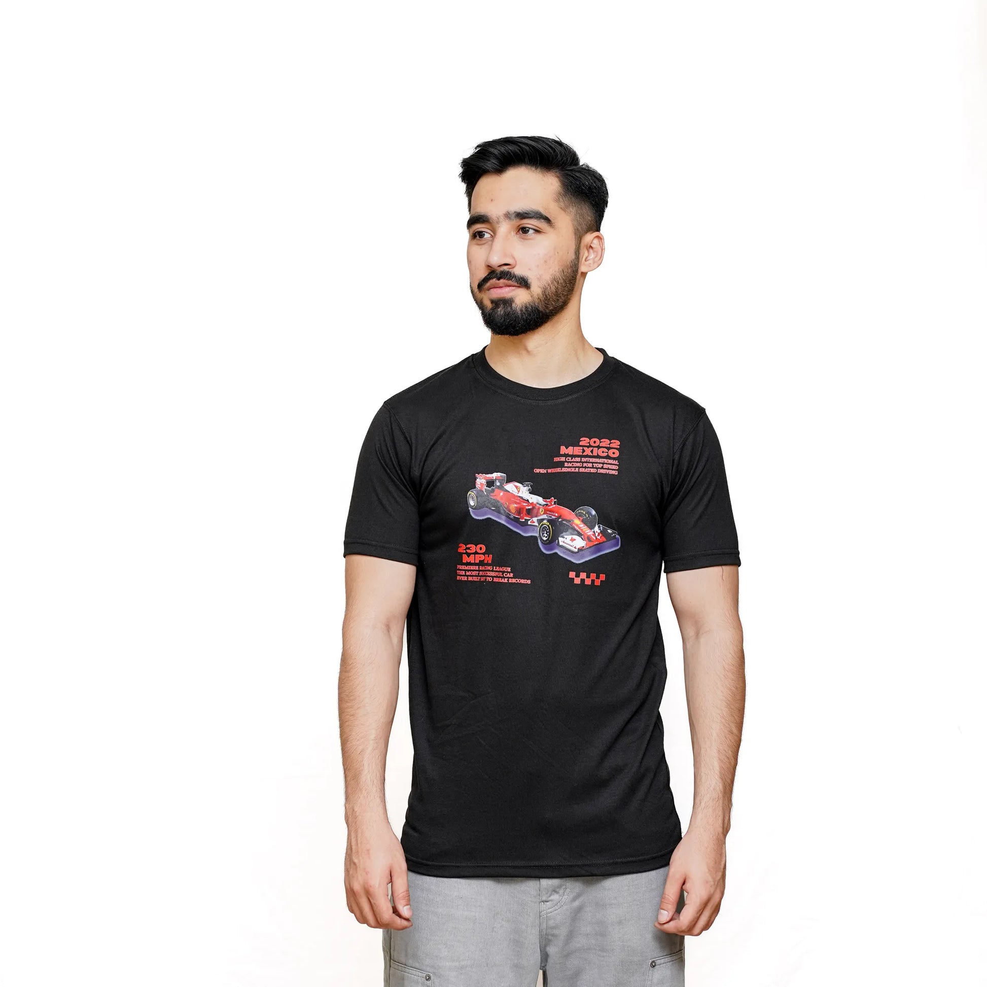 A man wearing a black Scuderia Ferrari F1 t-shirt with a graphic of a red racing car on it.