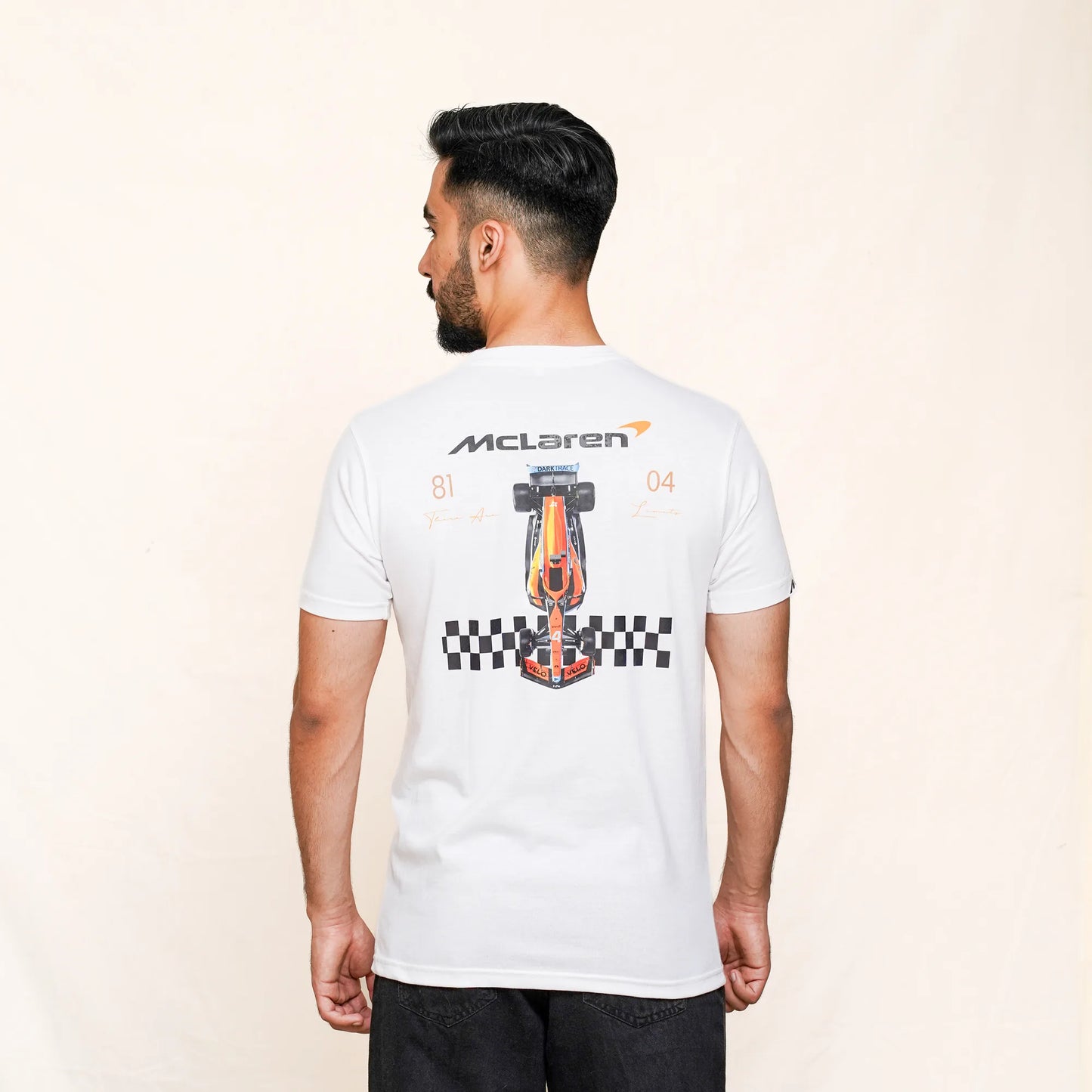 McLaren F1 racing car artwork printed on back of white tee with numbers 81 and 04.