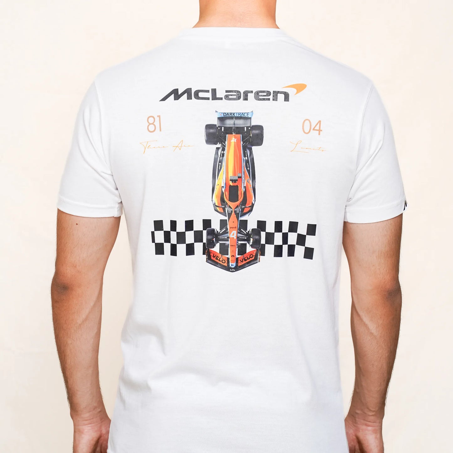 Orange McLaren Formula 1 car illustration with checkered flag pattern on White T-shirt.