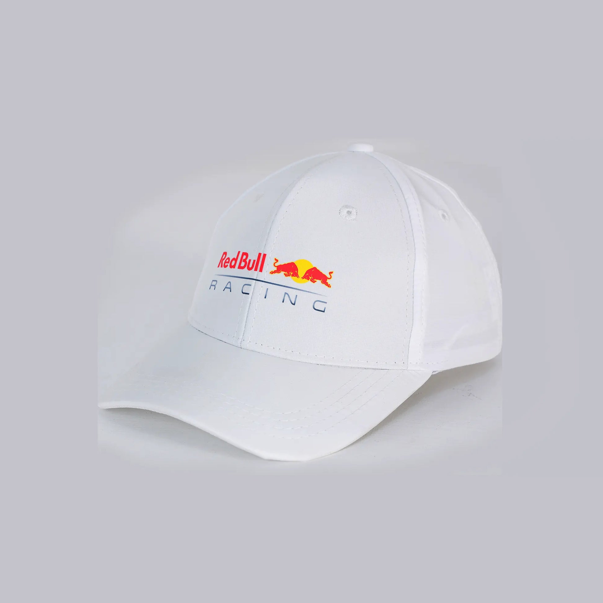 White cap with Red Bull Racing logo on a light gray background